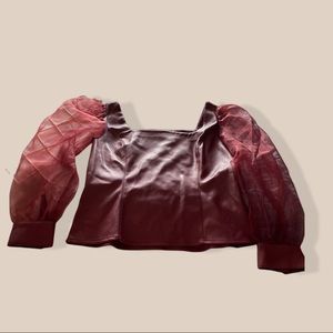 Classy leather top with shimmer long sleeves.